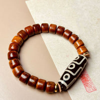 KarmaRipple's Tibetan Yak Bone Nine-Eye Dzi Bead Protection Bracelet